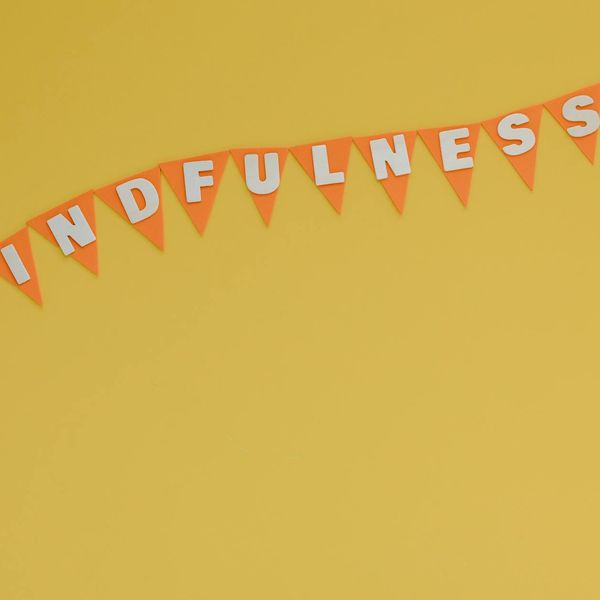 Person looking thoughtfully towards a bright window, symbolizing mental clarity.